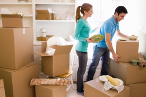 Couple unpacking boxes Couple unpacking boxes